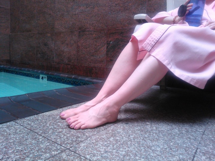womans legs at a spa pool