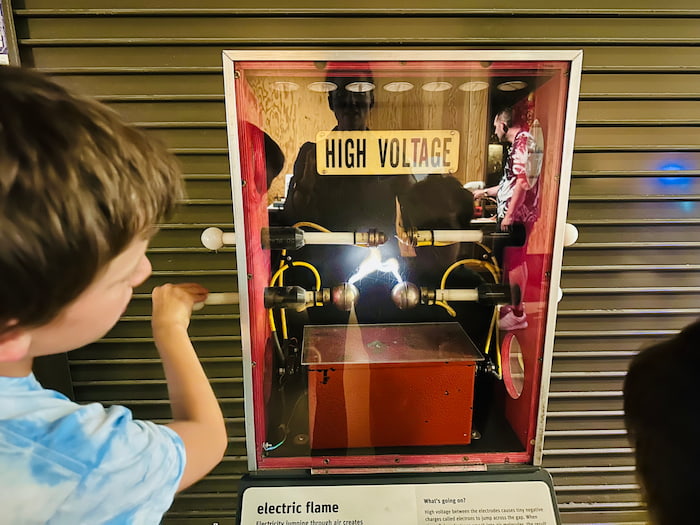 child using high voltage exhibit