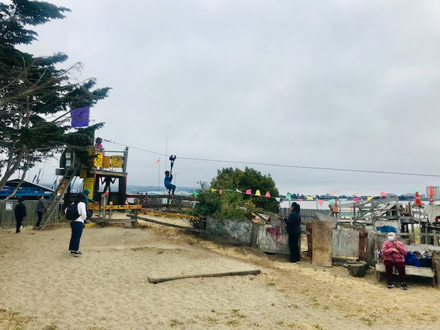 kid riding zip-line