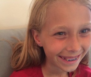 Kid report on getting ears pierced at Zebra Tattoo Piercing parlor