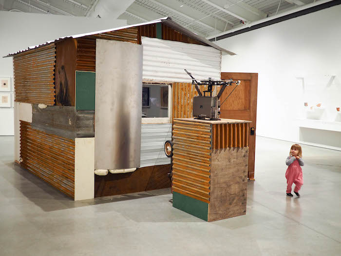 toddler exploring a large art installation