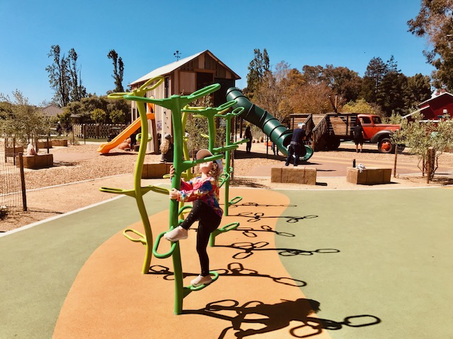 child climbing at playground