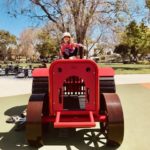 child riding tractor