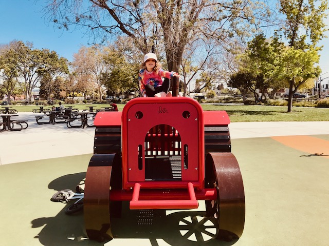 child riding tractor