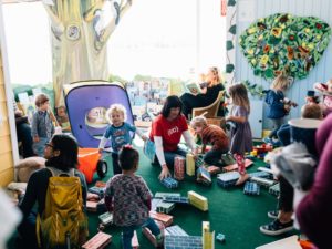 Carol playing with young kids at 510 families 7th birthday party
