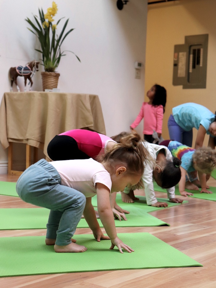 toddler doing yoga at Yama Kids Yoga