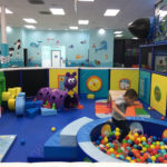Jace jumping into ball pit in Crawler Zone
