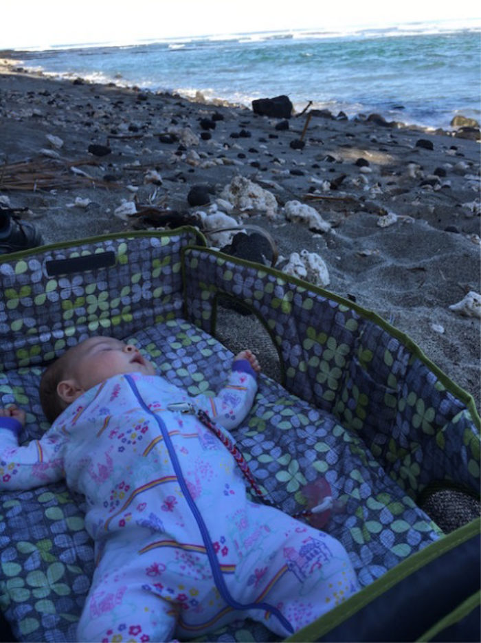 Baby napping on the beach