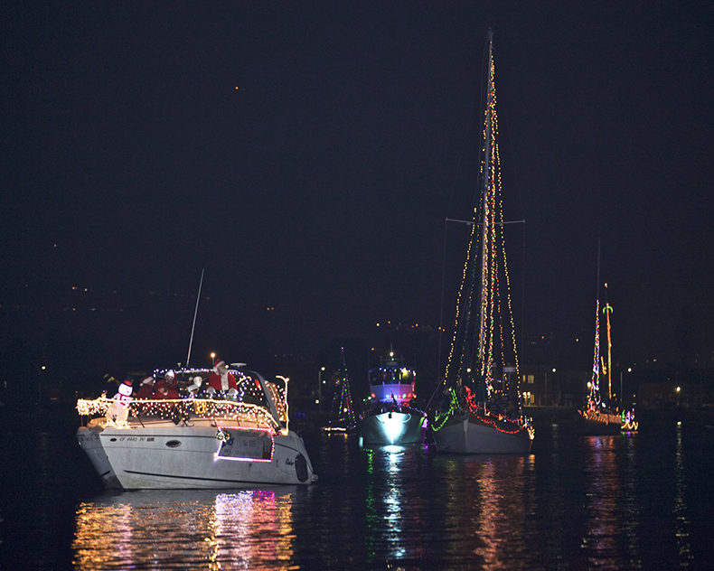 boats with holiday lights