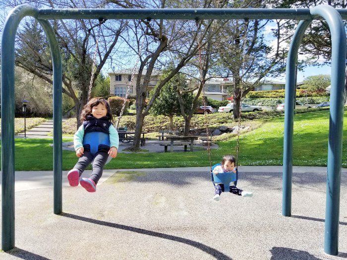 Kids on baby swings at Arlington Park, El Cerrito