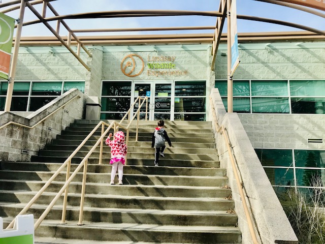two small kids climbing stairs