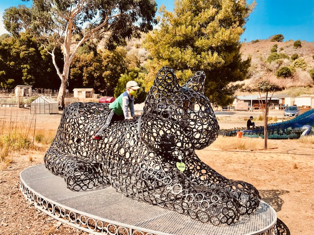 Sea Glass Treasure, A Pirate Ship & Burning Man Art in Richmond 5 boy on cat statue