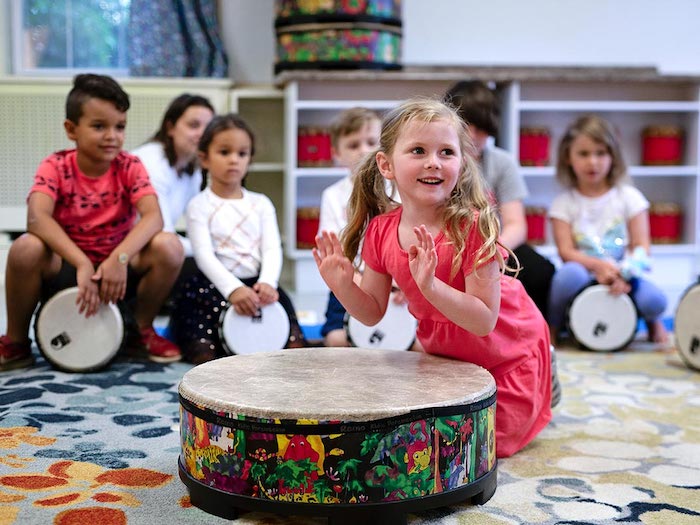 big kids playing percussion in a circle