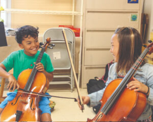 children playing cellos