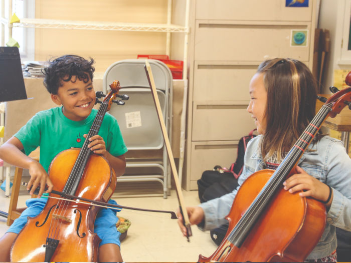 children playing cellos
