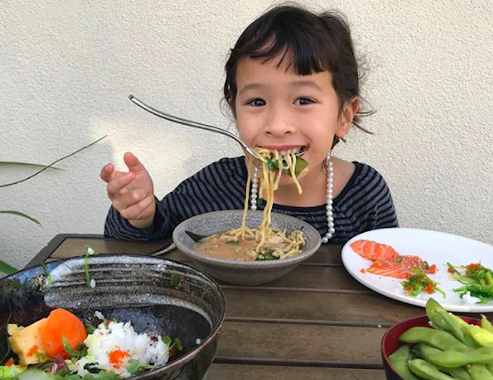 kid eating thai food