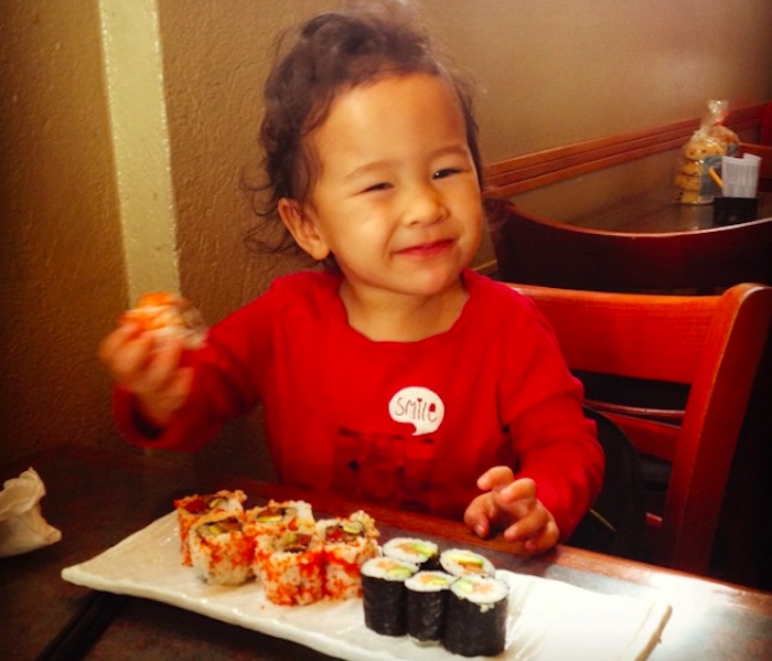 baby eating sushi rolls
