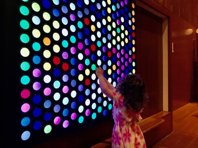 toddler with light wall