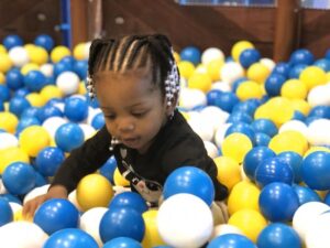 jolly roger land ball pit with playing child
