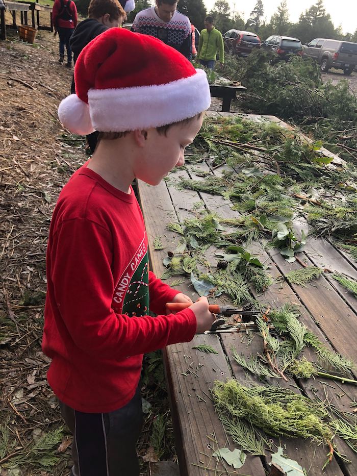 Rancho Siempre Verde kid pretending to making wreath
