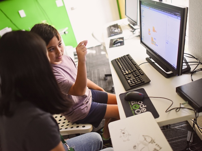 student learning scratch from a code coach