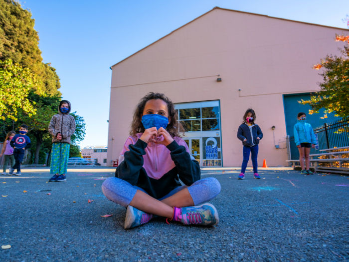 Head over heels students mask outdoors