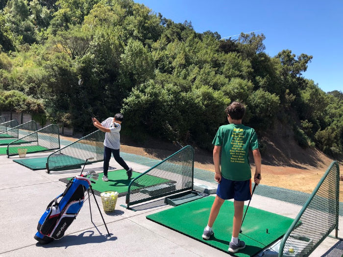 Montclair Golf Course driving range with kids and teens with mask