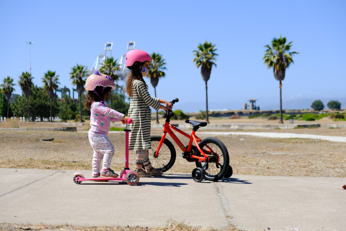 middle harbor trails and two girls on scooters