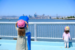 girl at middle harbor shoreline park looking across the bay