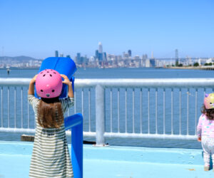 girl at middle harbor shoreline park looking across the bay