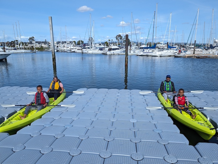 Family in kayaks on the San Francisco Bay