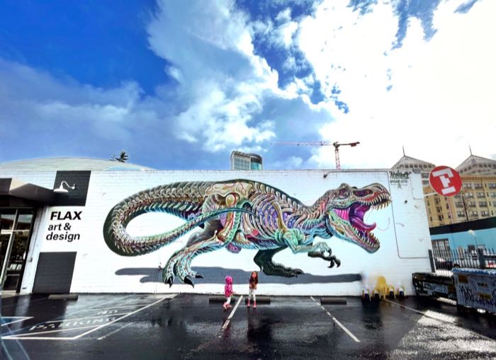flax t rex mural in parking lot