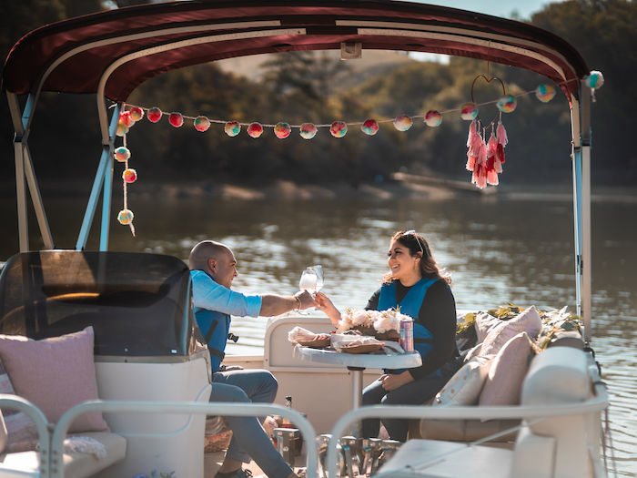 Two adults on a romantic pontoon at Lake Chabot