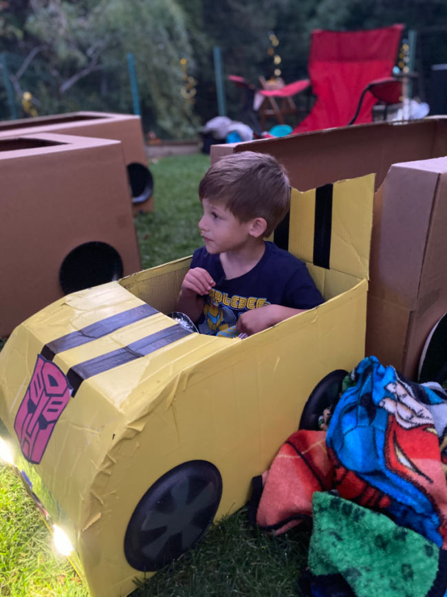 boy in bumblebee car box