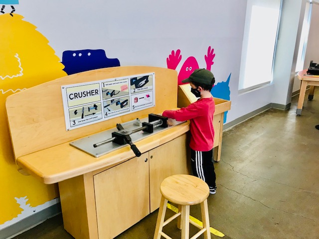 child playing with machine
