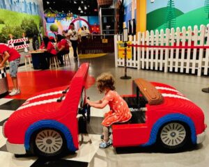 child driving LEGO car