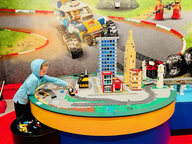 child playing with LEGO play area