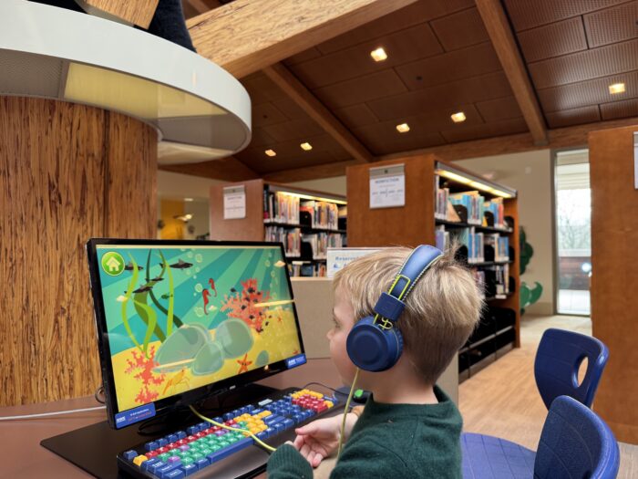 Child playing educational computer game at the Lafayette Library