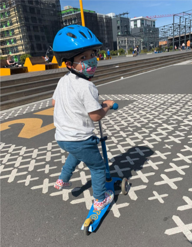 Rolling Around Brooklyn Basin (Oakland) with Kids 6 child on scooter with helmet