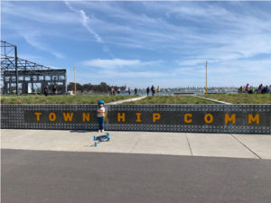 township commons sign and child