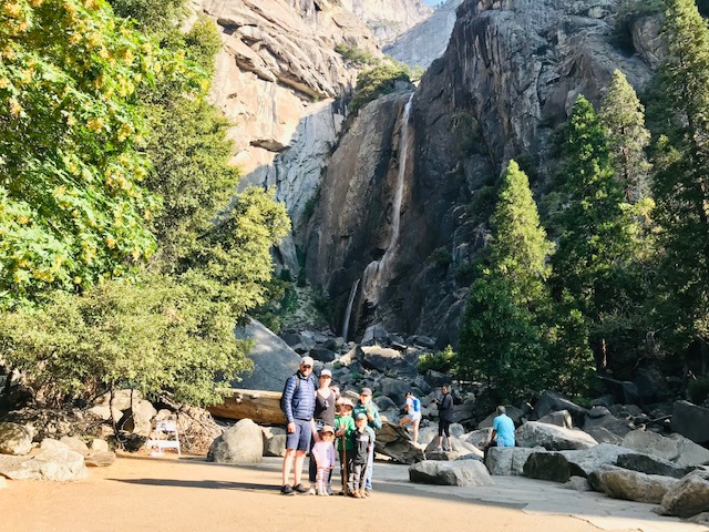 family by waterfall