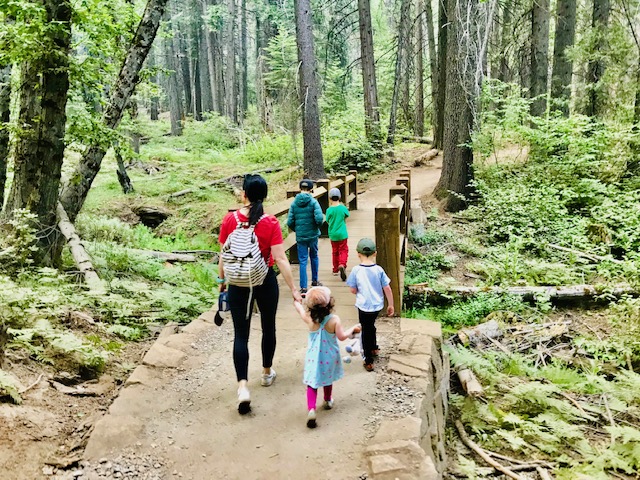 family hiking in forrest