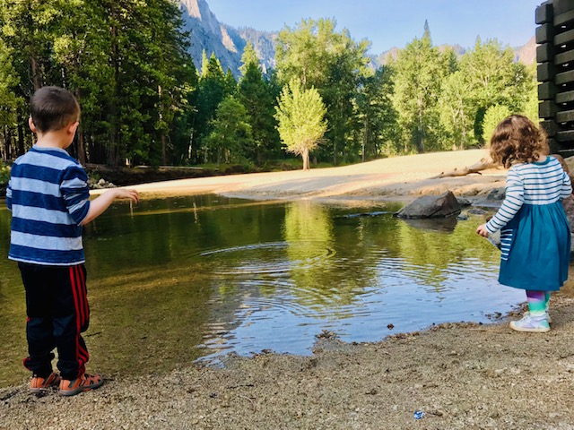 two kids by river