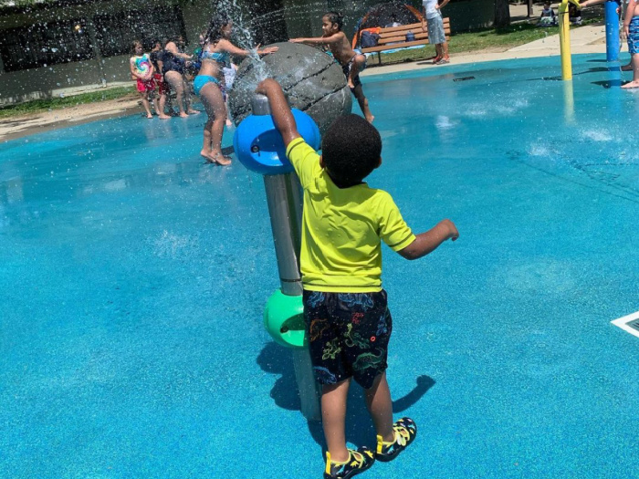 Castro Valley Park Splash Pad with child