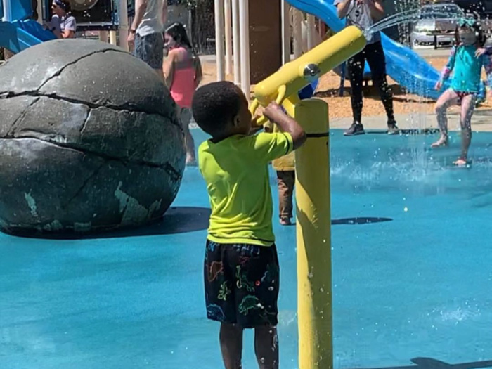 child spraying at Castro Valley Park Splash Pad