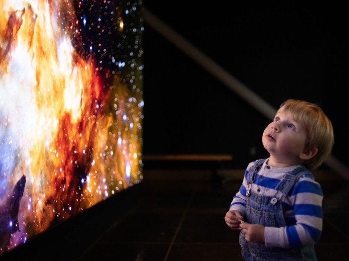 30 Things to Do With East Bay Kids in November 2 Child looking at photo of space