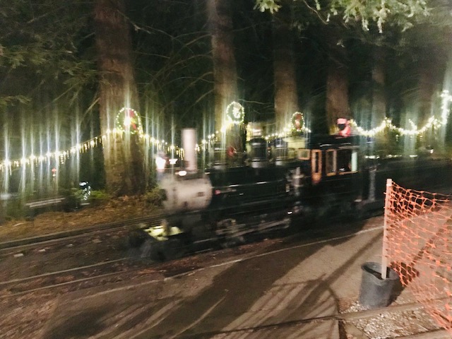 steam train at night with lights