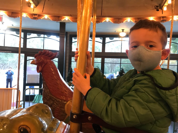 child on carousel at Tilden Park