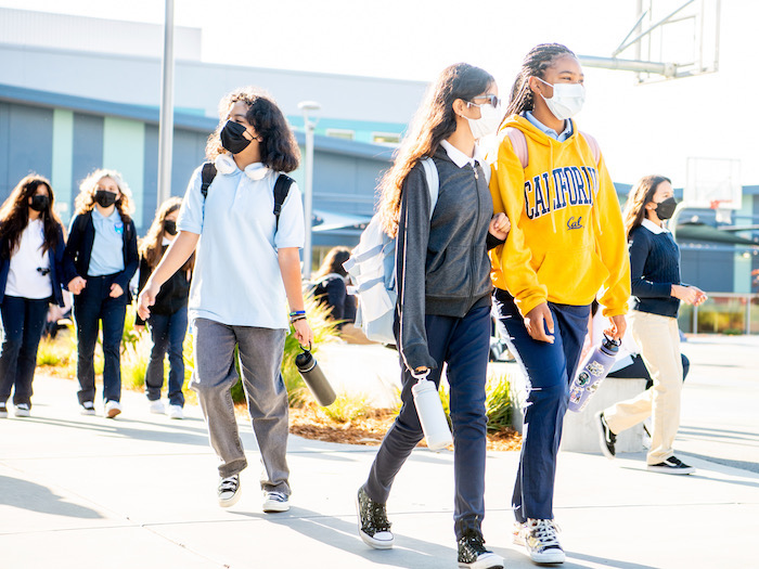 2023 Guide to East Bay Charter Schools 7 students walking around high school