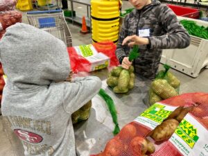 alameda community food bank packing potatoes